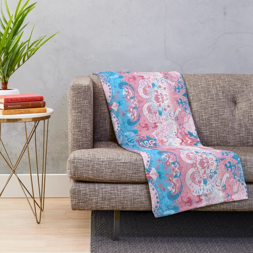 Colorful plush blanket featuring a transgender pride flag design and a dragon damask pattern