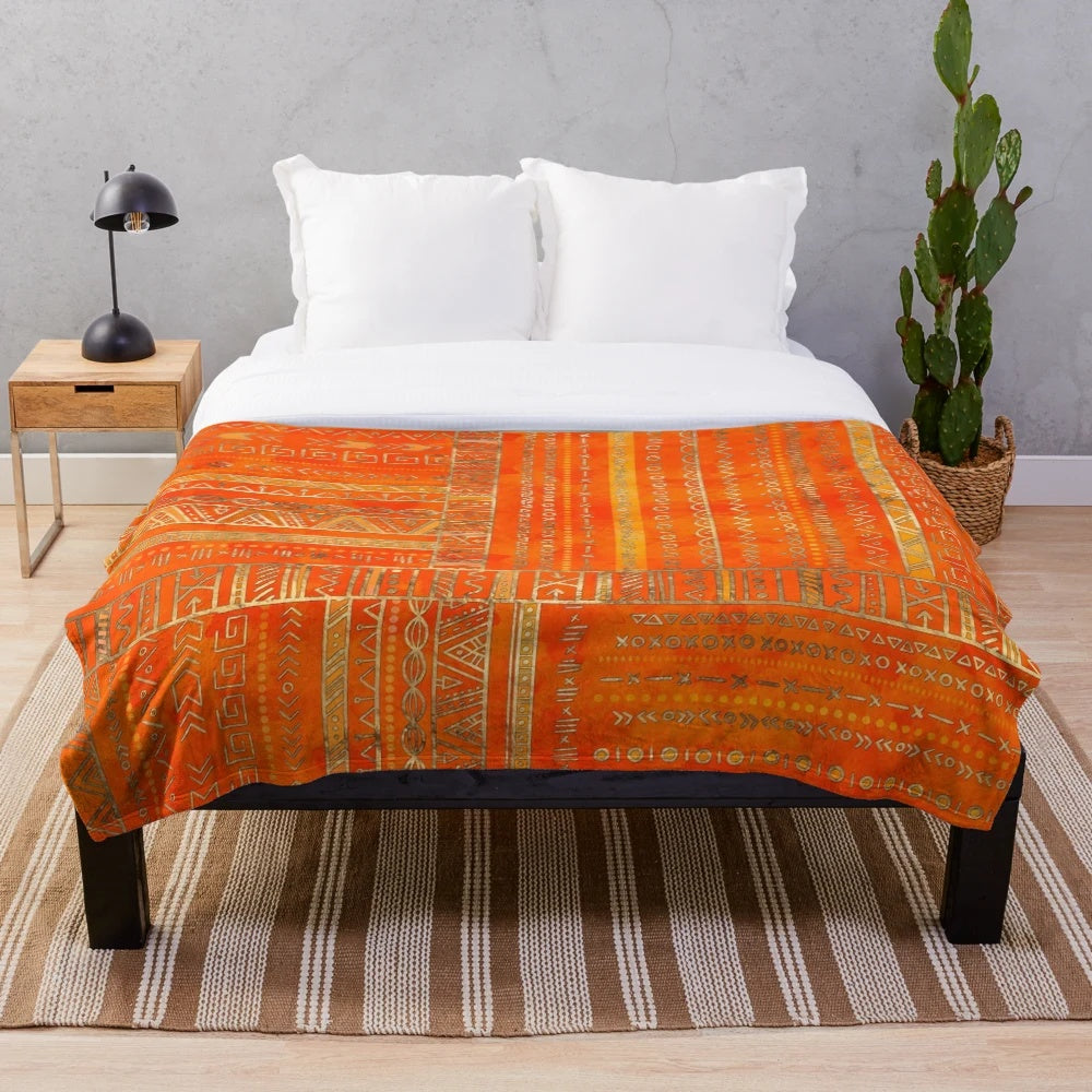 Tribal ethnic geometric pattern gold on orange plush blanket