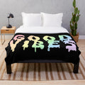 Colorful trippy plush blanket with melting, psychedelic design