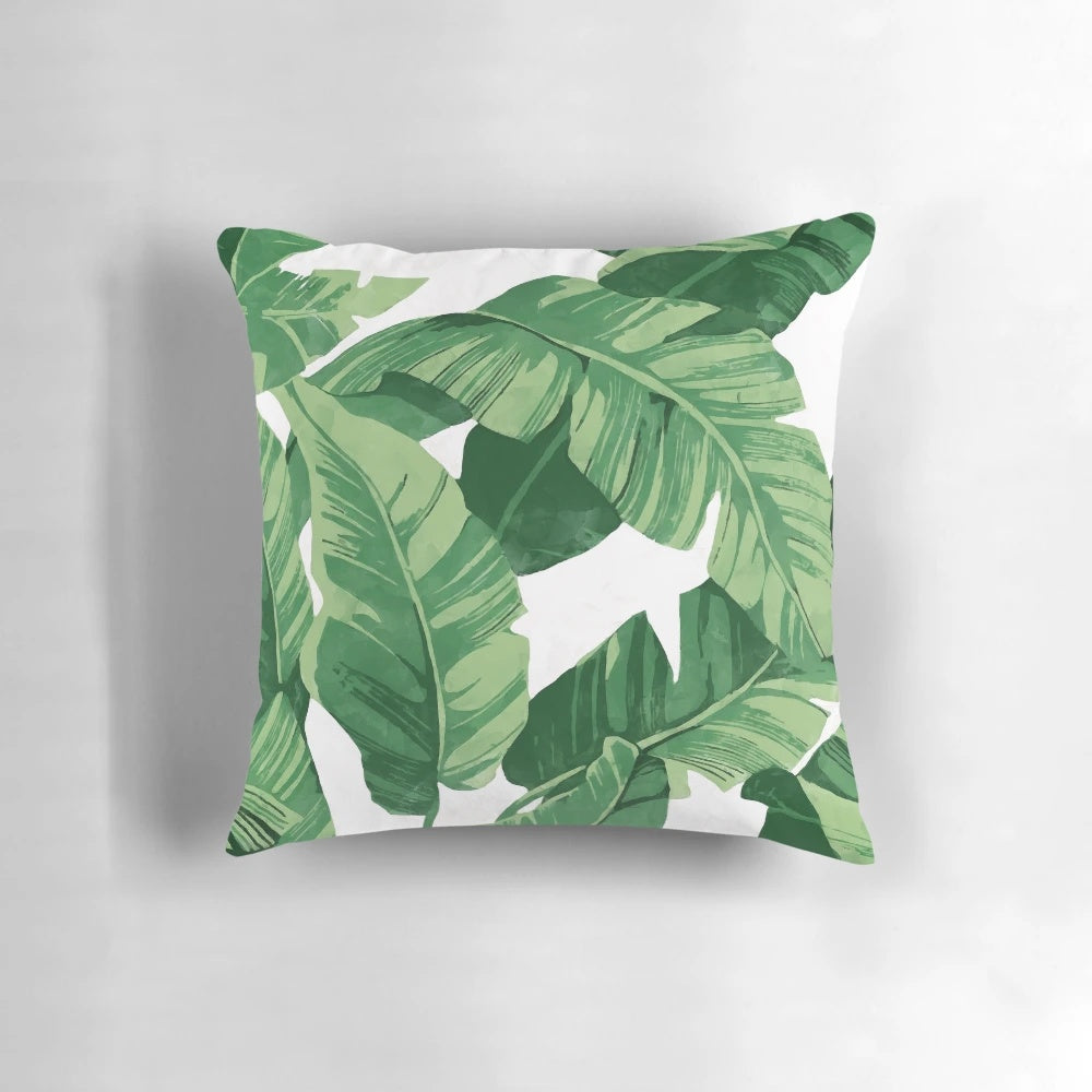 Lush tropical banana leaves pillow with a watercolor pattern, perfect for a nature-inspired home decor
