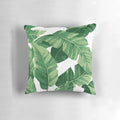 Lush tropical banana leaves pillow with a watercolor pattern, perfect for a nature-inspired home decor