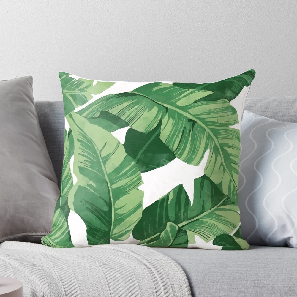 Lush tropical banana leaves pillow with a watercolor pattern, perfect for a nature-inspired home decor