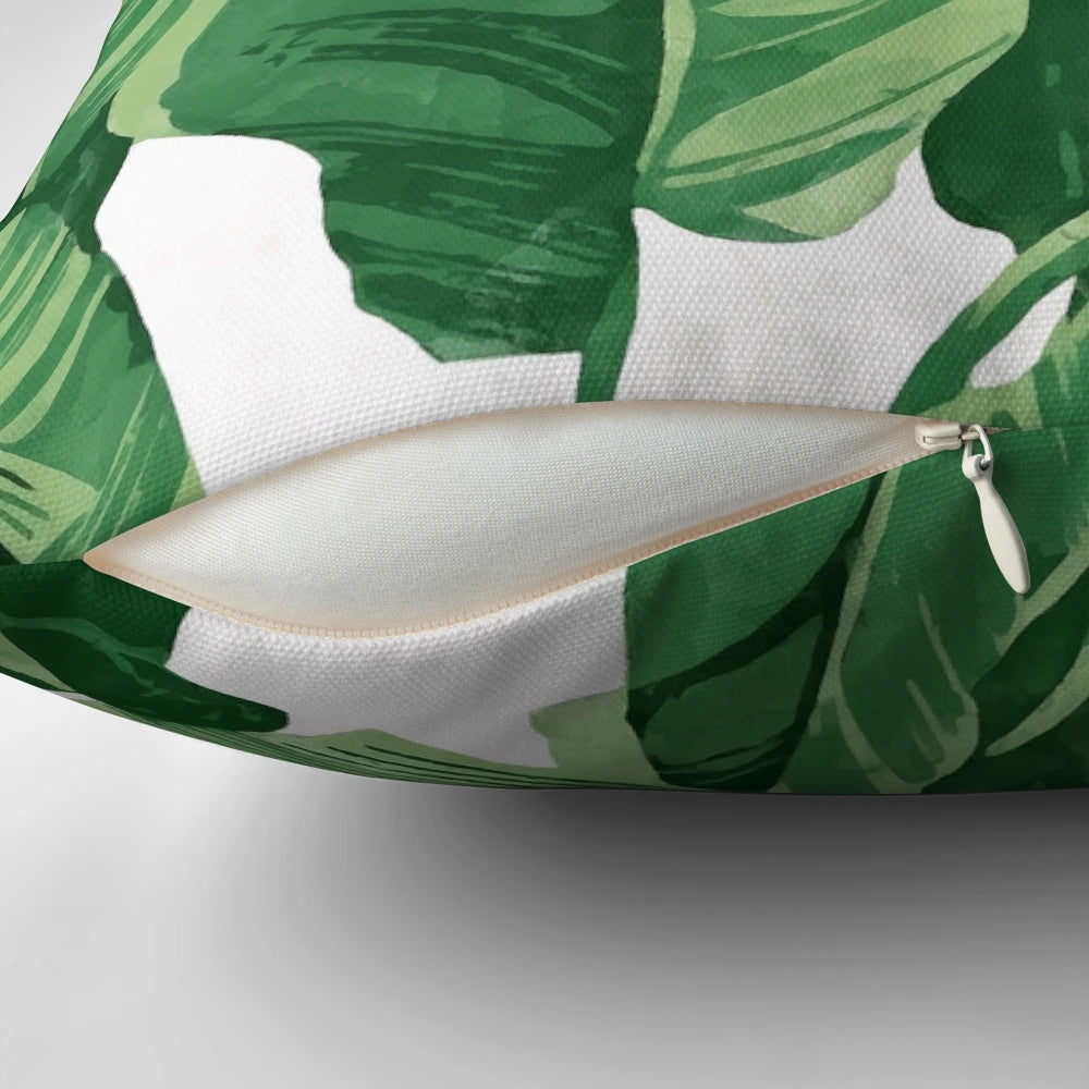 Lush tropical banana leaves pillow with a watercolor pattern, perfect for a nature-inspired home decor