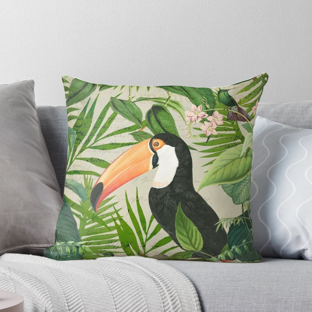 Decorative pillow featuring a vibrant print of a toucan and hummingbird in a lush, tropical setting.