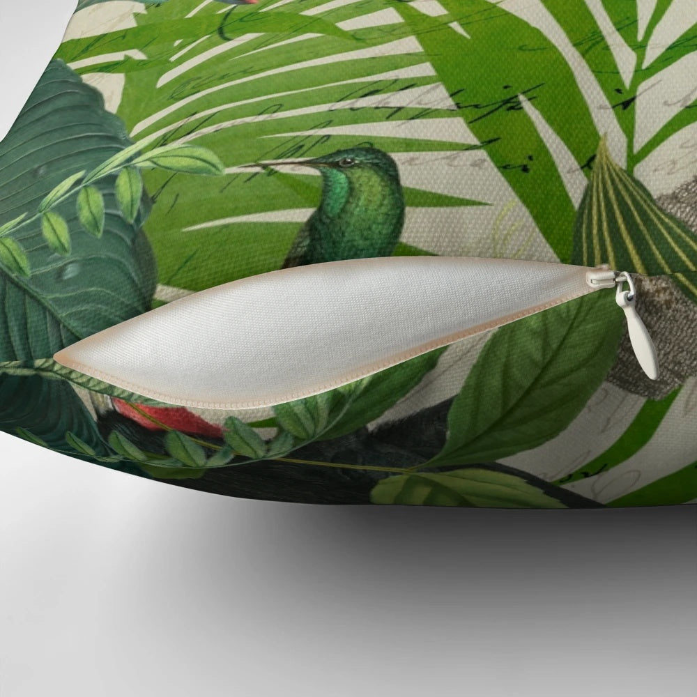 Decorative pillow featuring a vibrant print of a toucan and hummingbird in a lush, tropical setting.