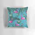 Tropical flamingo pattern pillow with colorful exotic leaves and foliage on an aqua blue background
