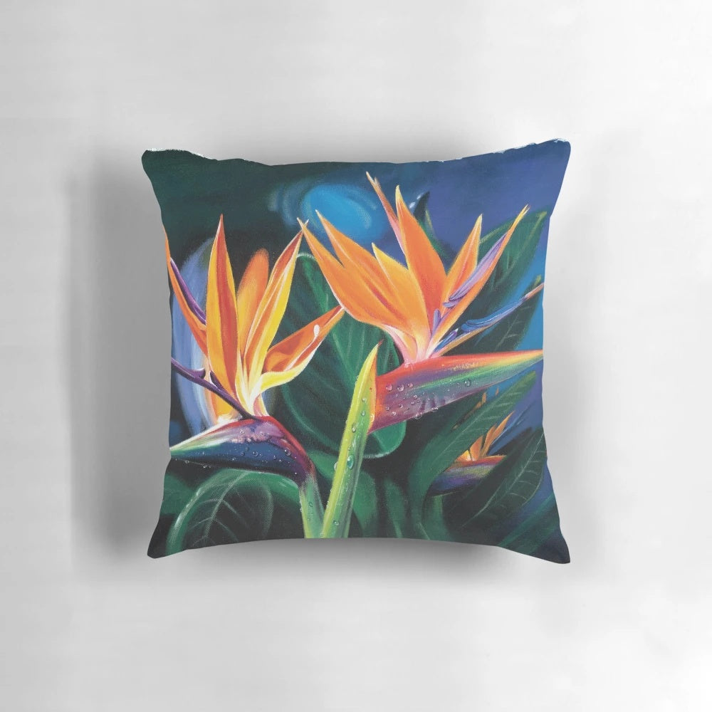 Colorful pillow featuring tropical flowers and plants, inspired by the beauty of Hawaii