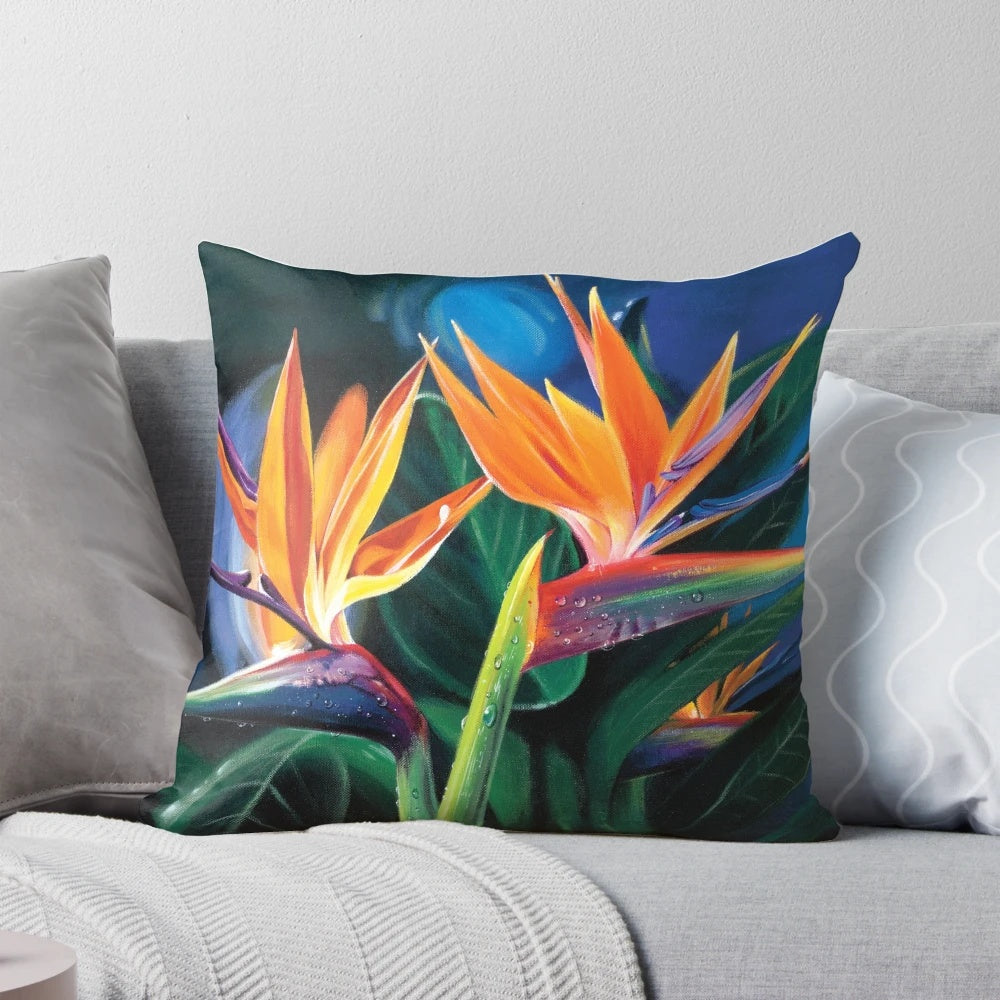 Colorful pillow featuring tropical flowers and plants, inspired by the beauty of Hawaii