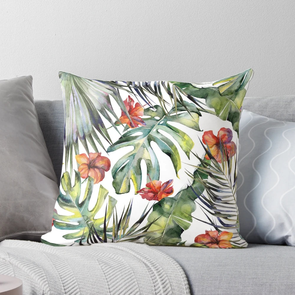 Colorful tropical garden themed decorative throw pillows featuring watercolor leaves, birds of paradise, and monstera plants