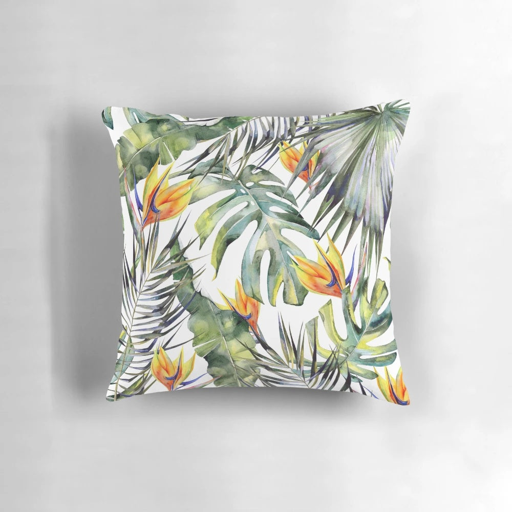 Tropical garden themed decorative pillow cover featuring vibrant watercolor leaves, birds of paradise, and palm fronds.