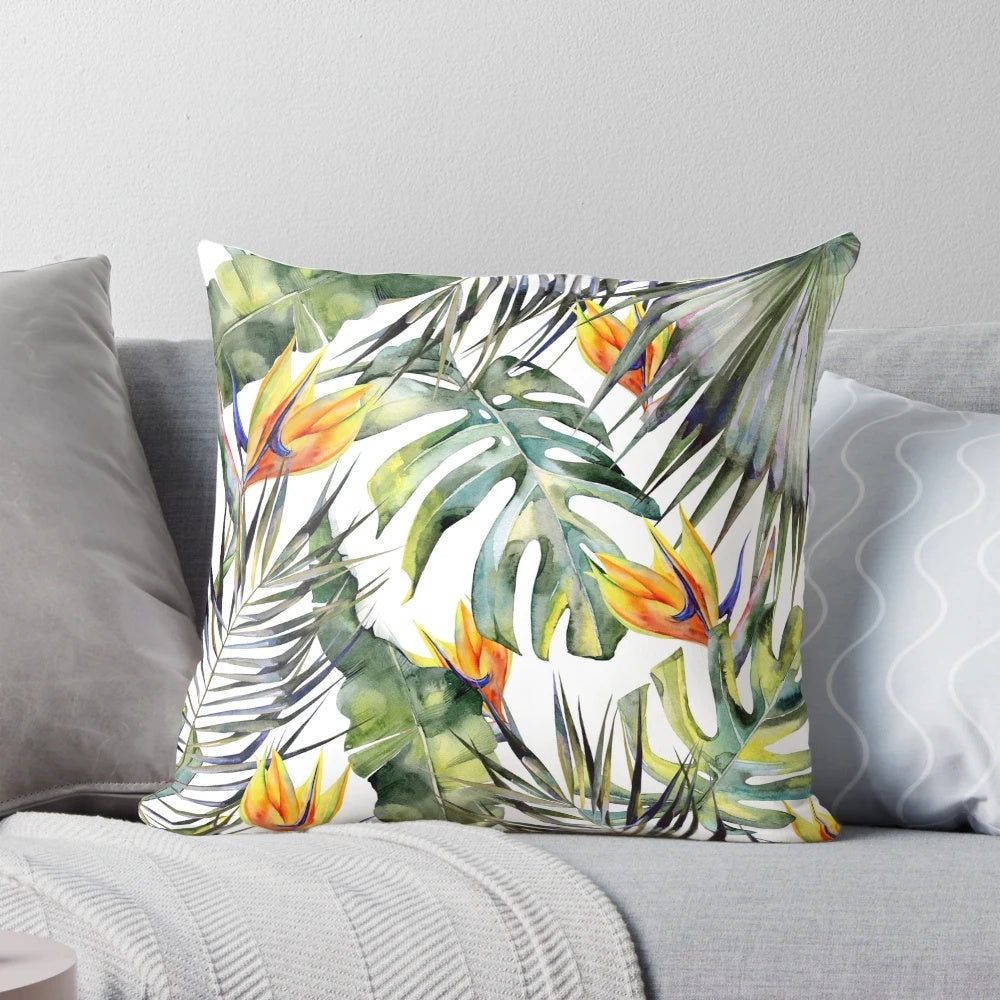 Tropical garden themed decorative pillow cover featuring vibrant watercolor leaves, birds of paradise, and palm fronds.