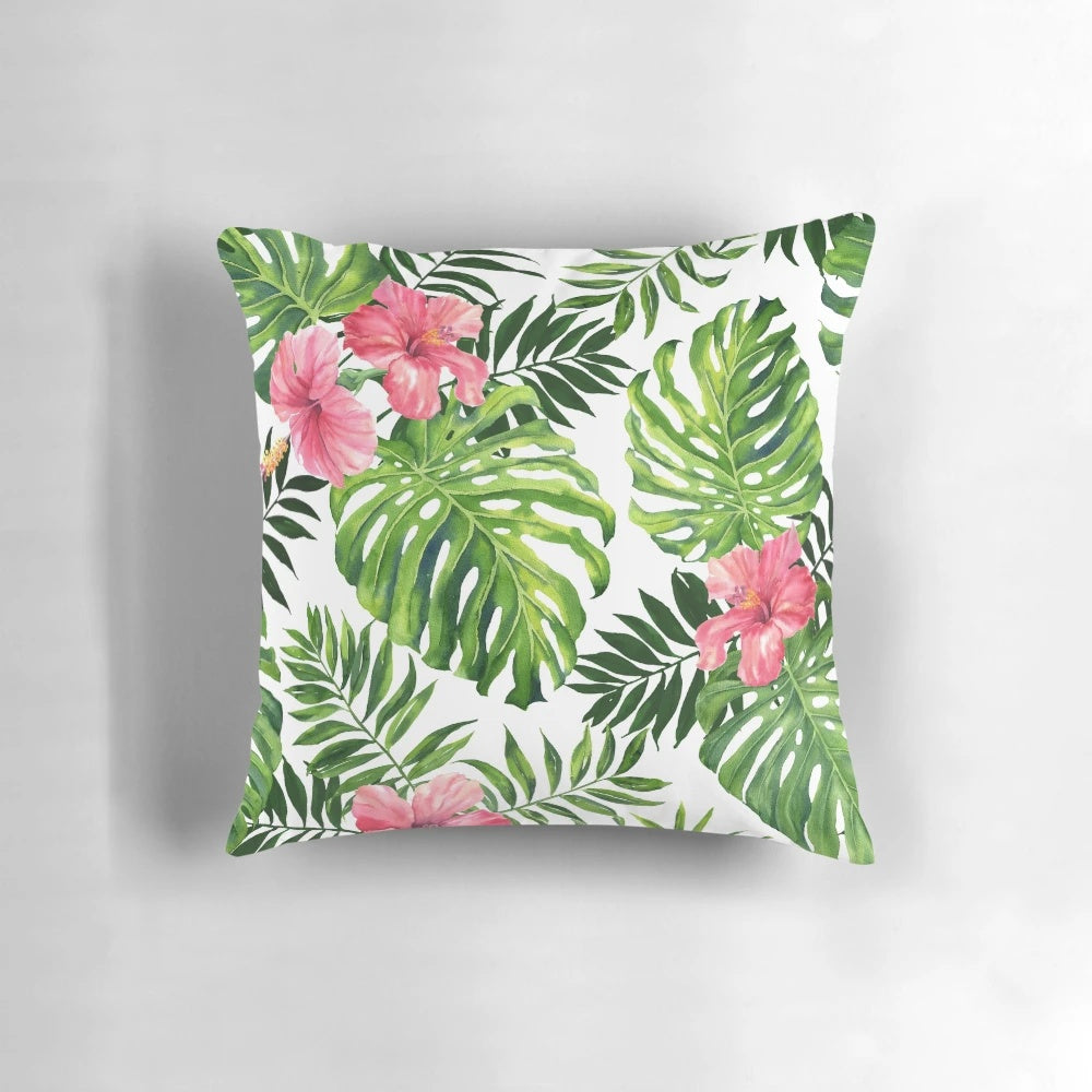 Lush tropical hibiscus flower pattern printed on a high-quality pillow for a refreshing, botanical look.