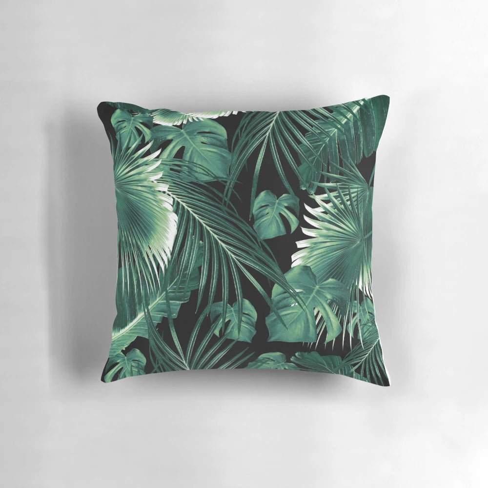 Digital collage of lush, green tropical leaves and foliage in a botanical design