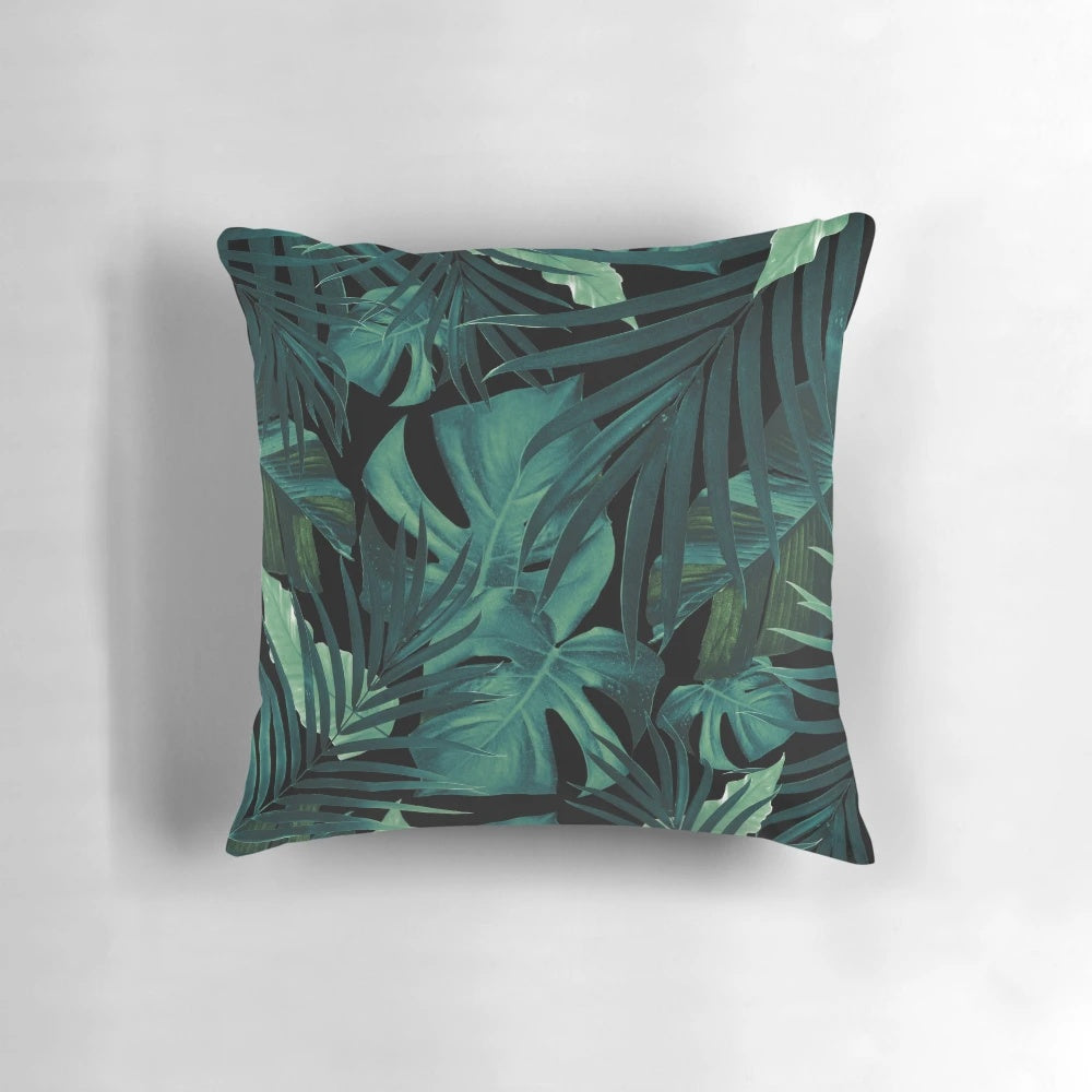Pillow featuring a vibrant tropical leaves pattern in a jungle night theme, perfect for botanical home decor.
