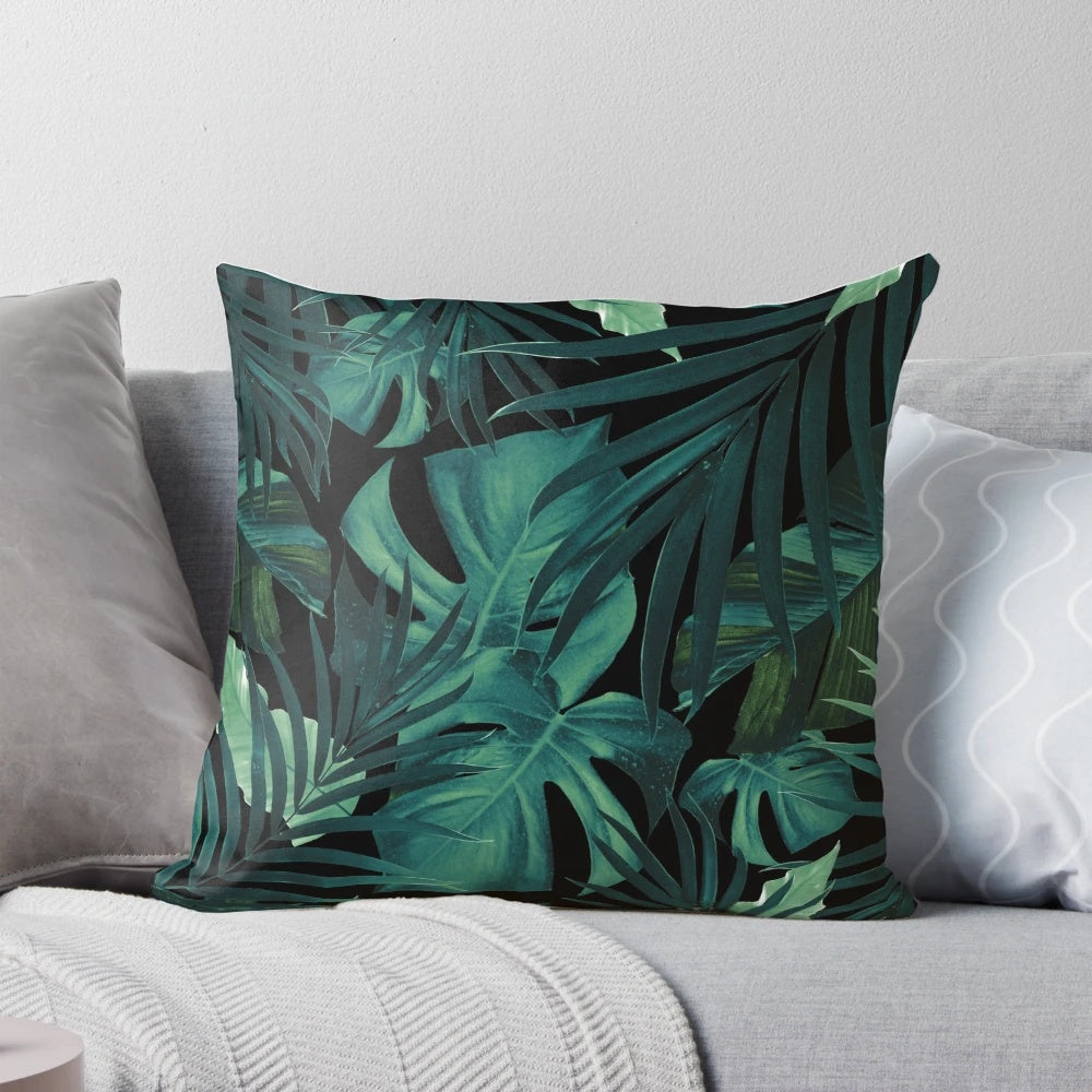 Pillow featuring a vibrant tropical leaves pattern in a jungle night theme, perfect for botanical home decor.