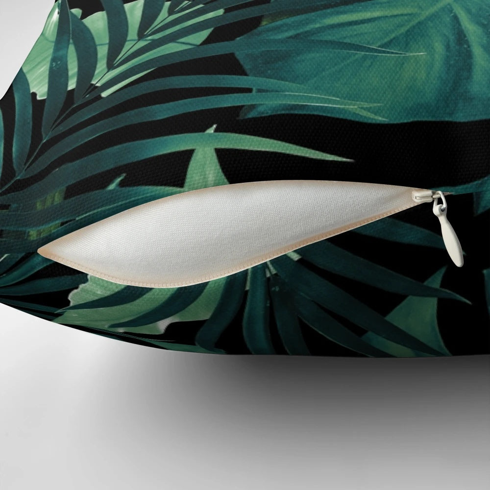 Pillow featuring a vibrant tropical leaves pattern in a jungle night theme, perfect for botanical home decor.