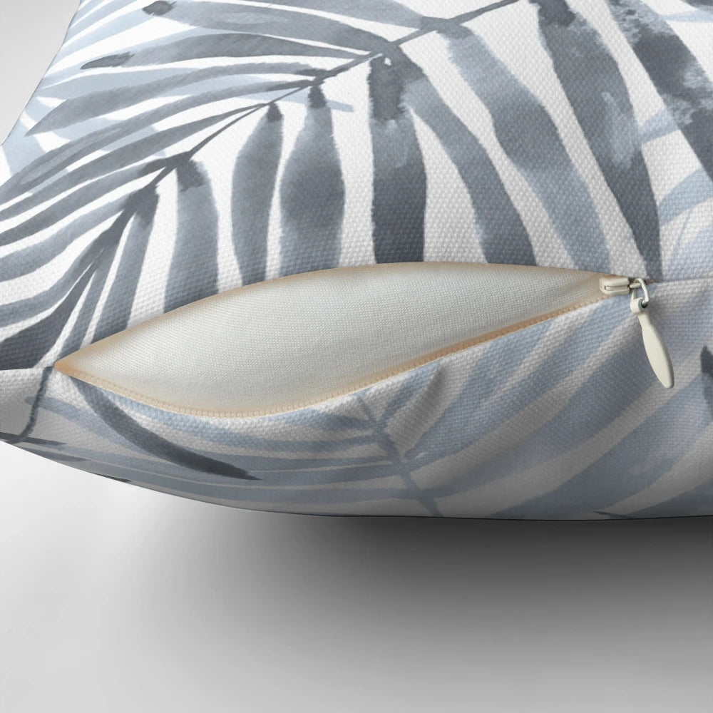 Decorative throw pillow featuring a vibrant watercolor pattern of tropical palm leaves and an exotic toucan bird.