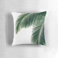 Tropical palm leaves in a watercolor design on a cozy pillow for home decor