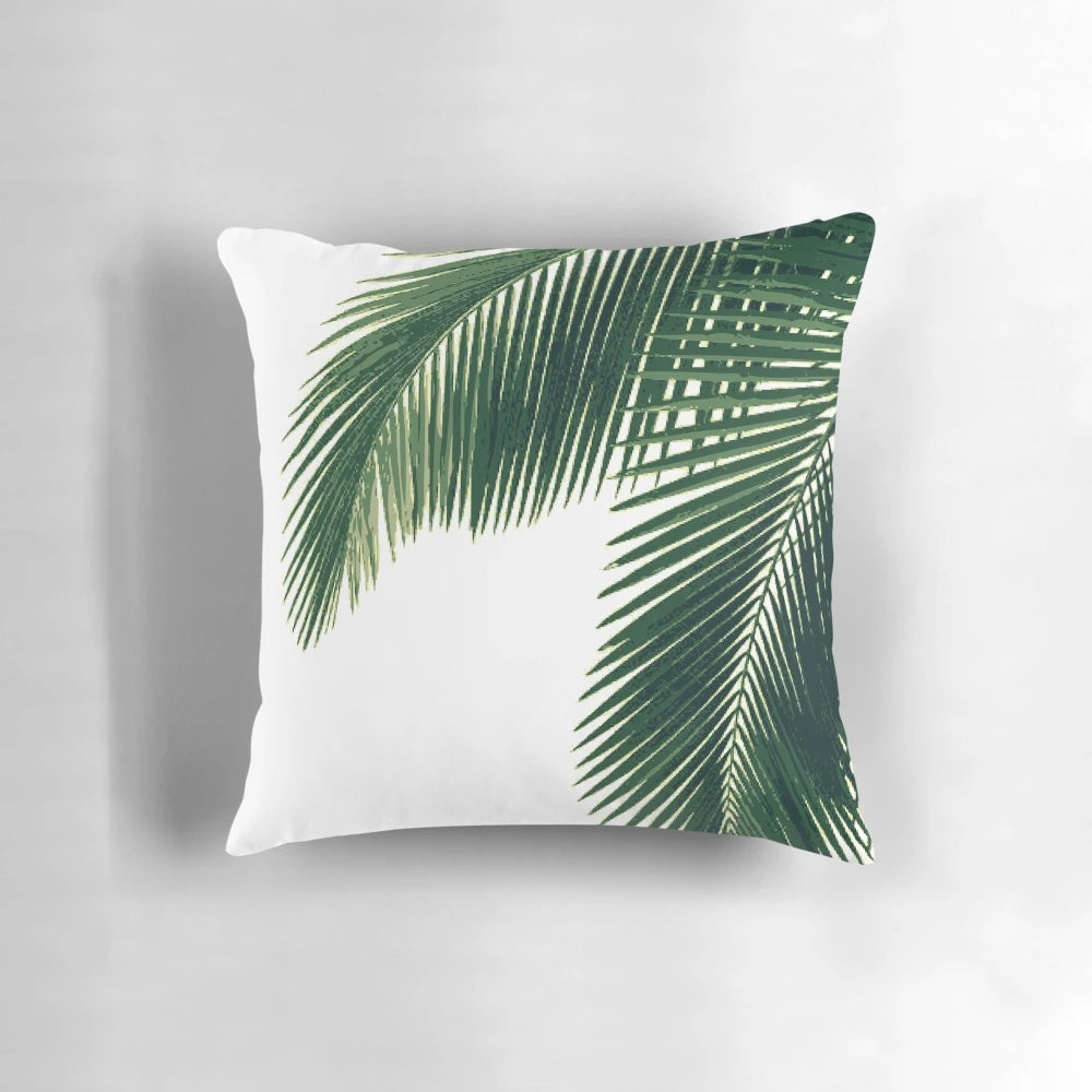 Tropical palm leaves in a watercolor design on a cozy pillow for home decor