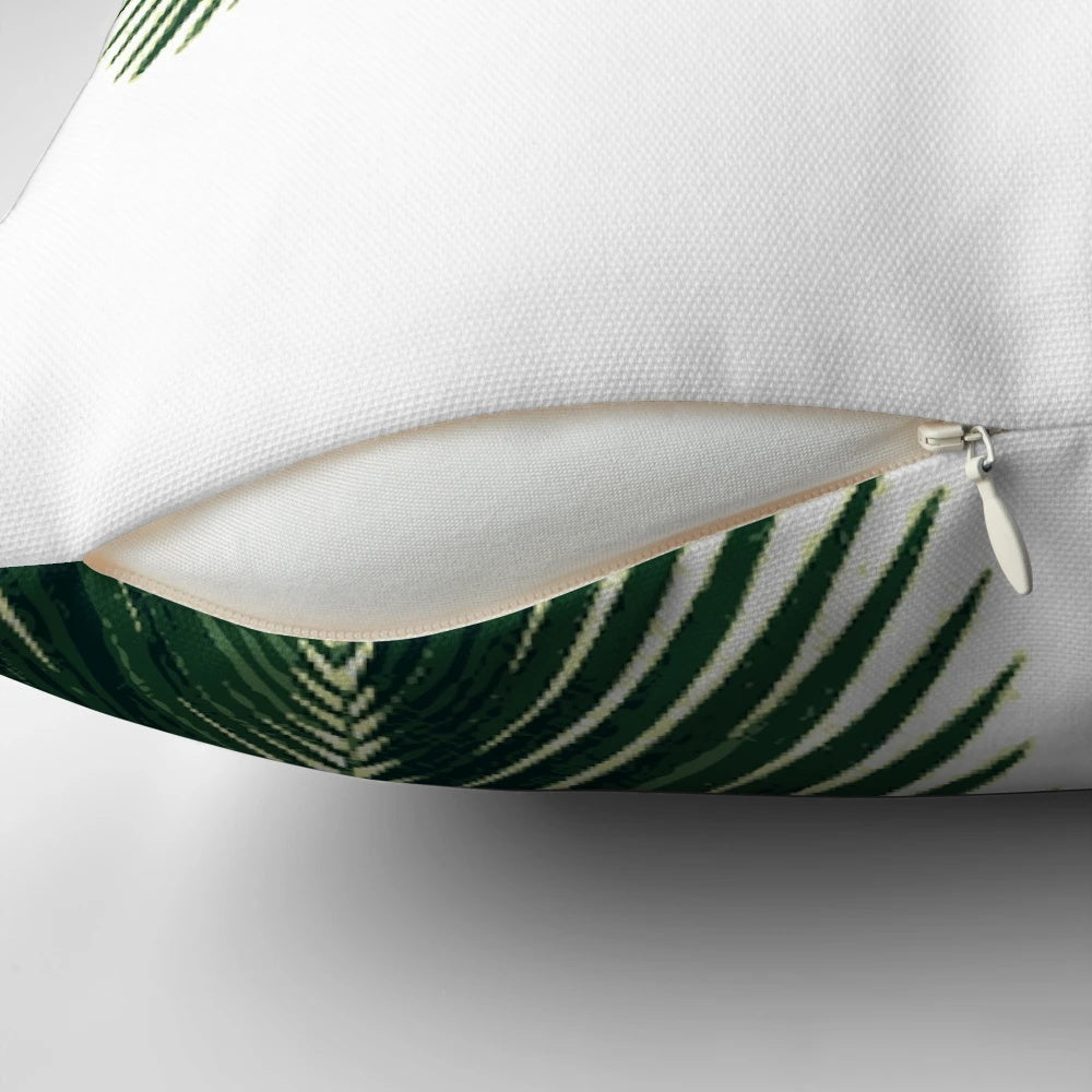 Tropical palm leaves in a watercolor design on a cozy pillow for home decor