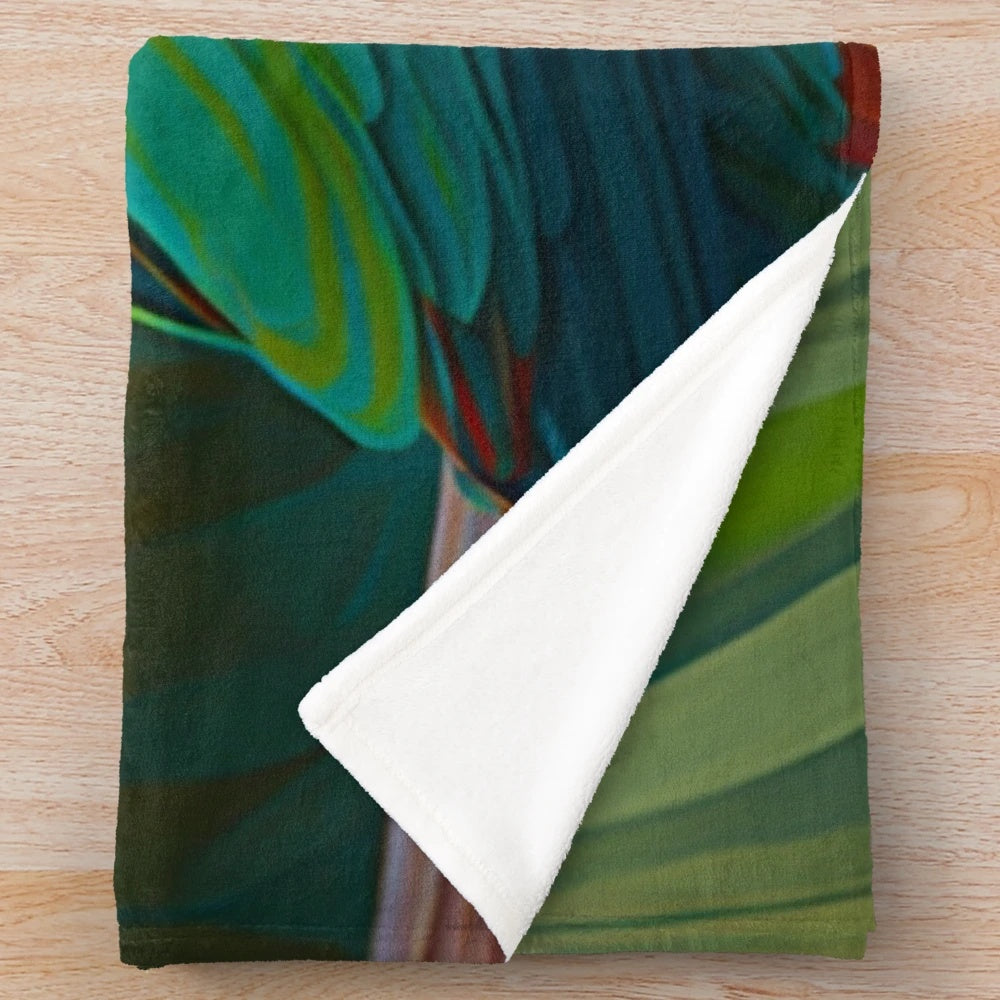 Lush green and colorful tropical parrot plush blanket