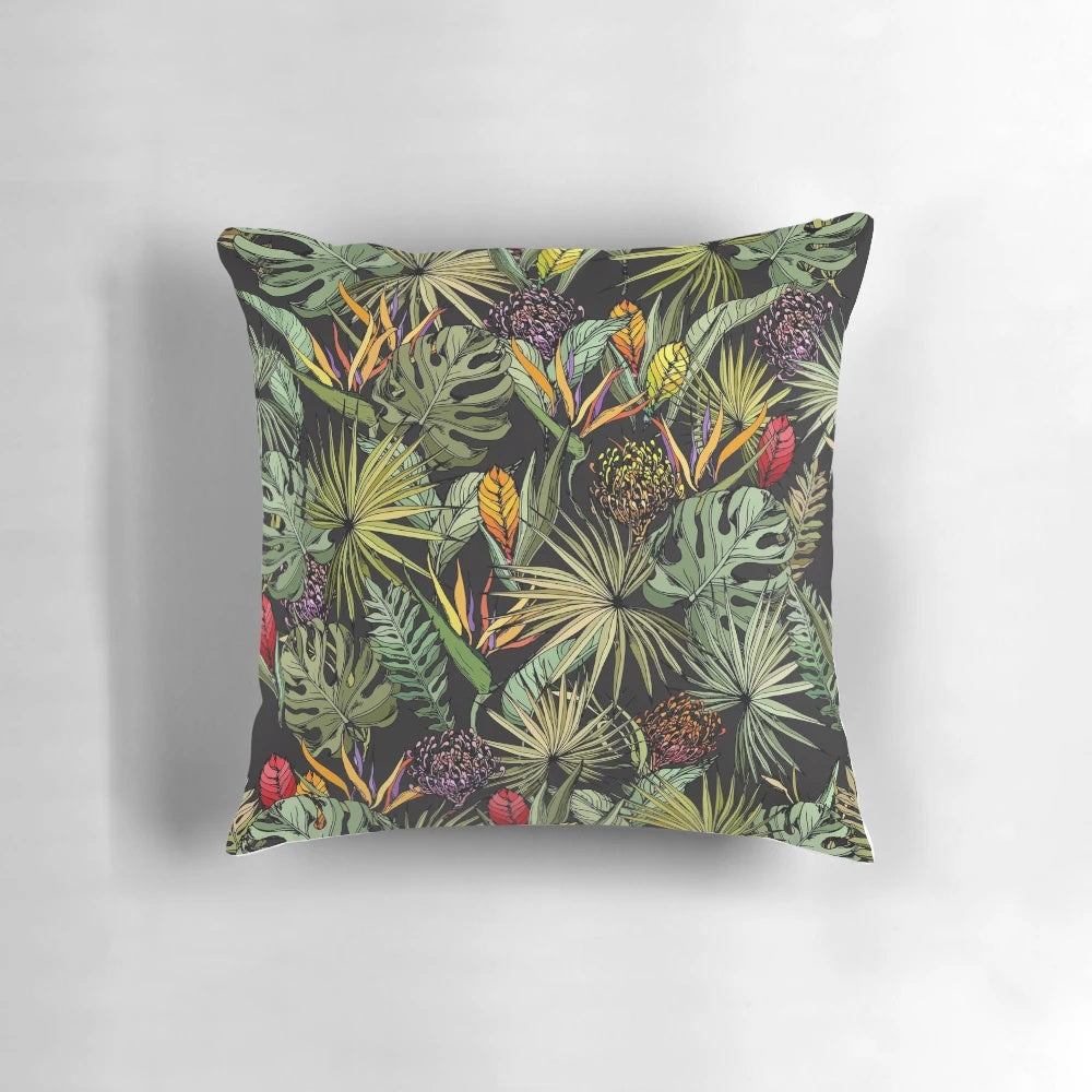 Tropical pattern black pillow with strelitzia, monstera, and palm leaf print