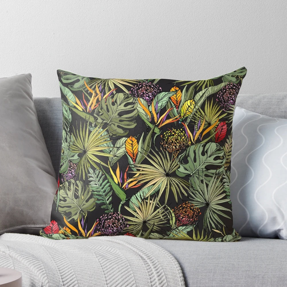 Tropical pattern black pillow with strelitzia, monstera, and palm leaf print