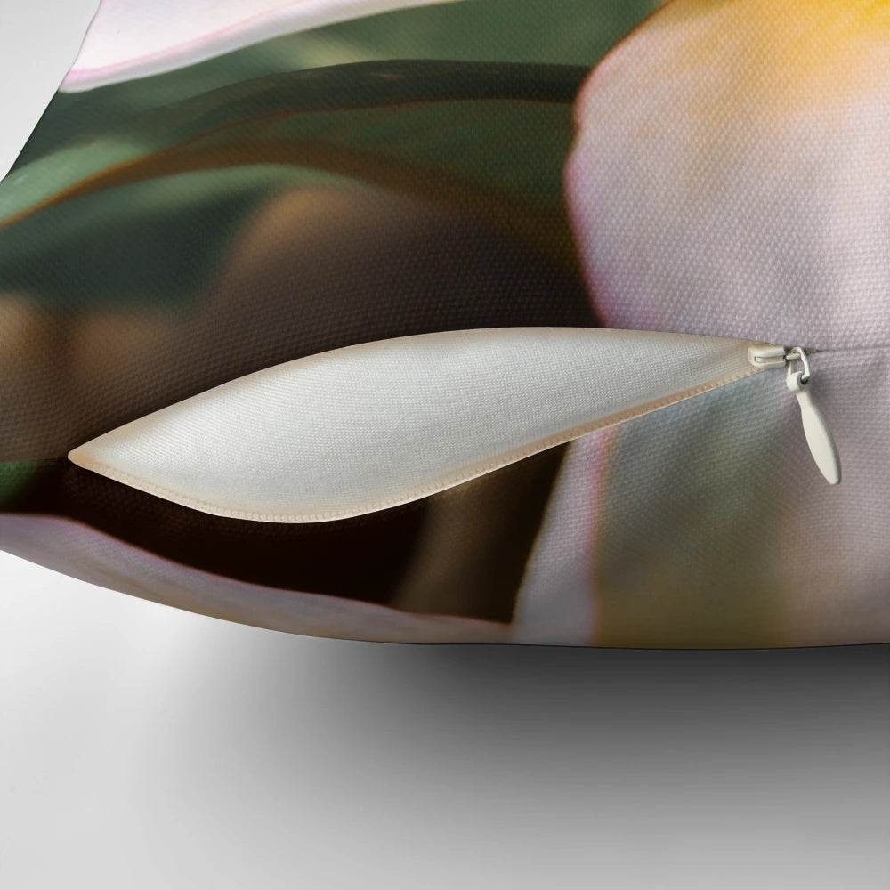 Pillow featuring vibrant orange plumeria or frangipani tropical flowers on a tree