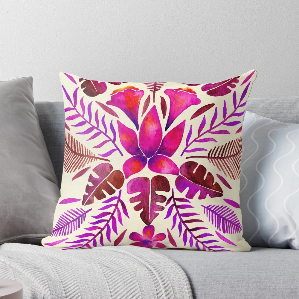 Tropical-inspired magenta throw pillow with symmetrical pattern, perfect for adding a touch of wanderlust to your home decor.