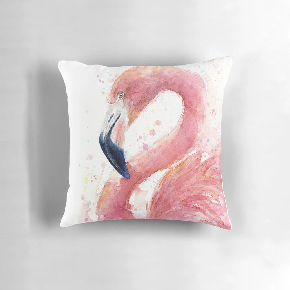 A beautiful watercolor painting of a pink flamingo on a decorative throw pillow.