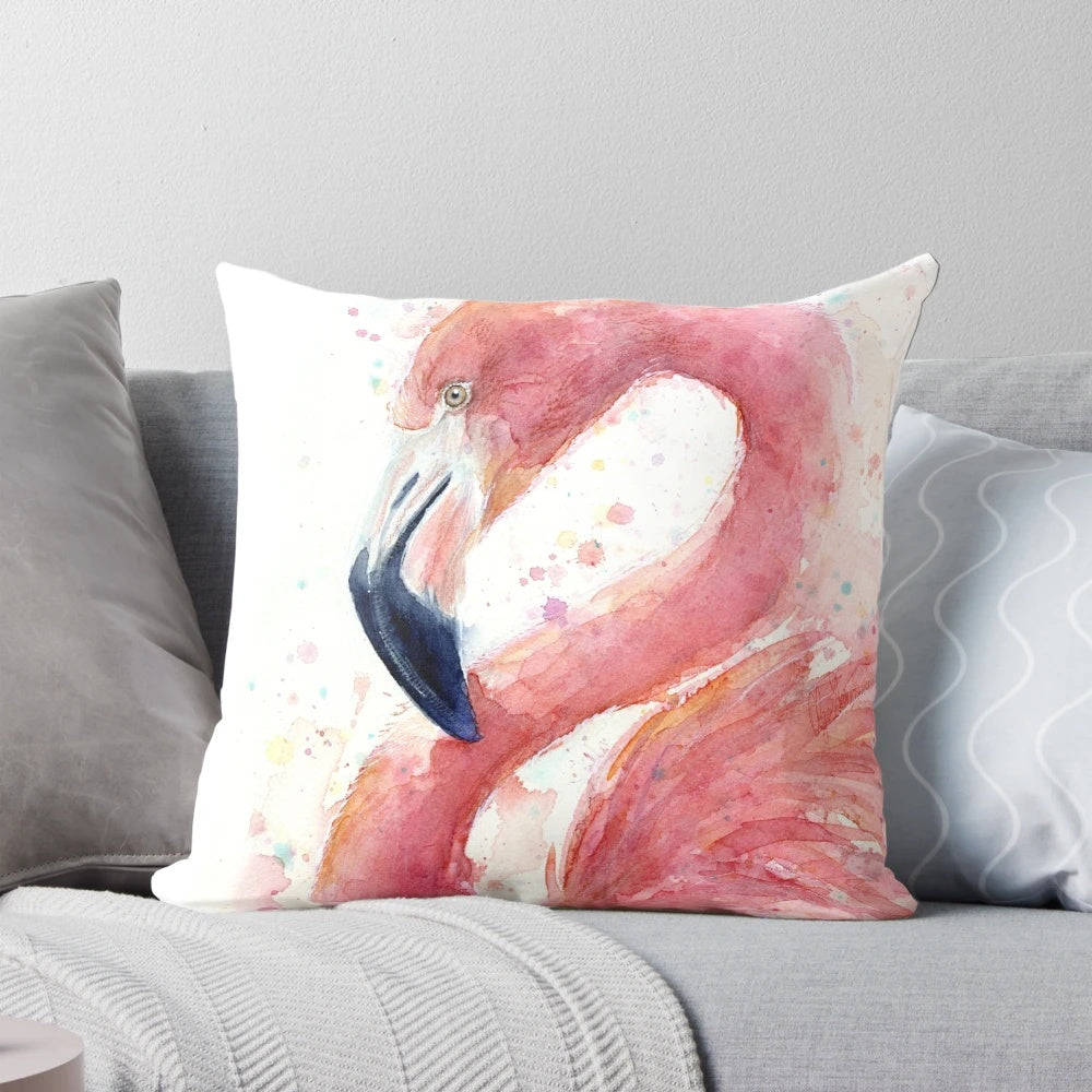 A beautiful watercolor painting of a pink flamingo on a decorative throw pillow.