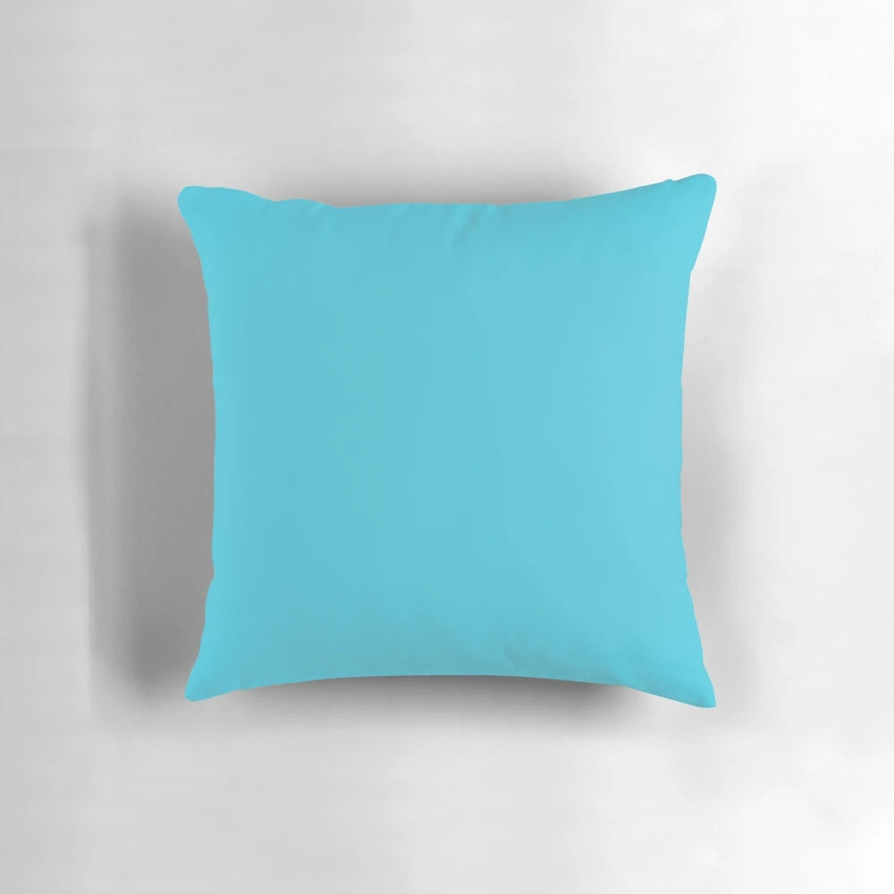 Turquoise pillow with minimalist digital art design