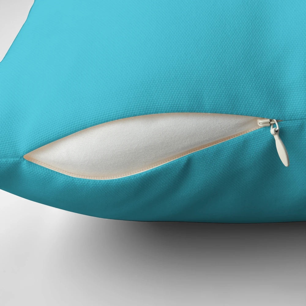 Turquoise pillow with minimalist digital art design