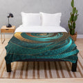 Vibrant turquoise fractal design on a plush blanket
