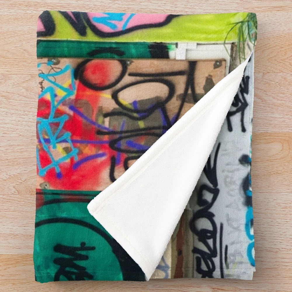 Colorful graffiti-style plush blanket with urban design