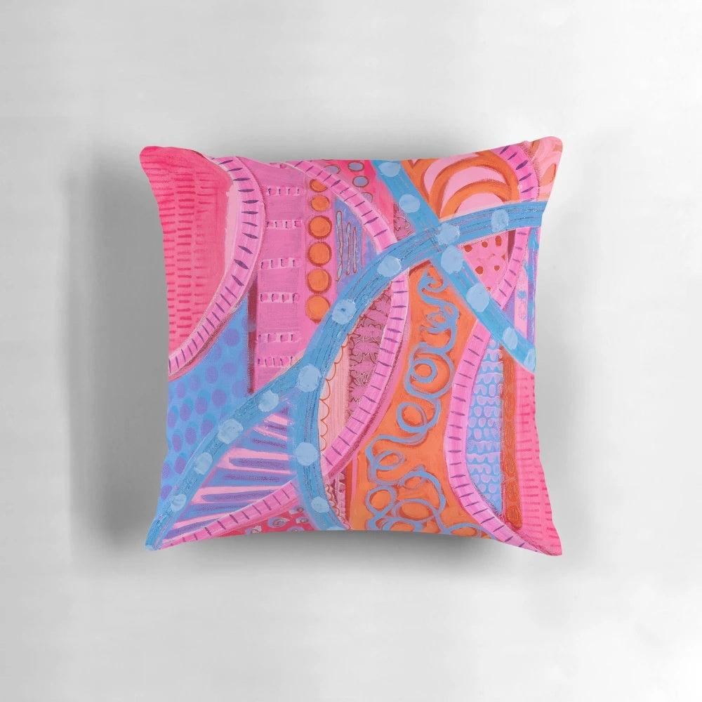 Vibrant, colorful square pillow with abstract urban design