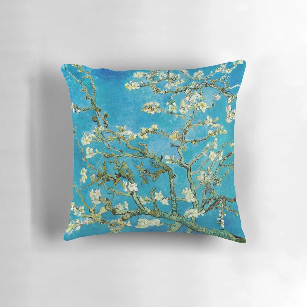 Vibrant blue and white almond blossom painting by Vincent Van Gogh printed on a soft, cozy pillow.