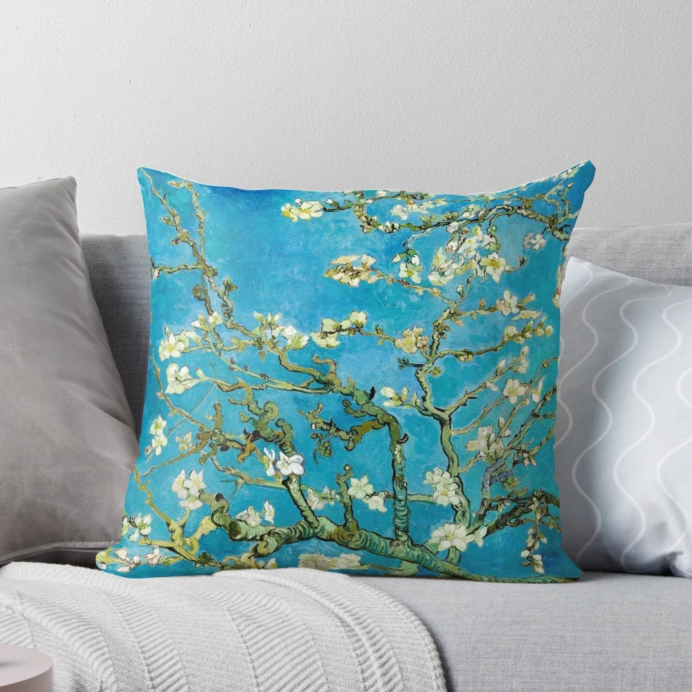 Vibrant blue and white almond blossom painting by Vincent Van Gogh printed on a soft, cozy pillow.