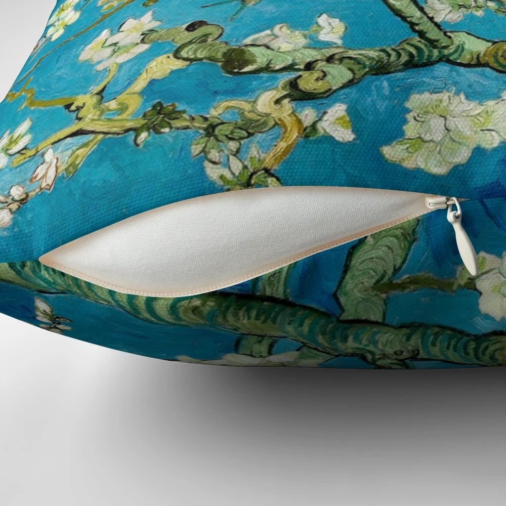 Vibrant blue and white almond blossom painting by Vincent Van Gogh printed on a soft, cozy pillow.