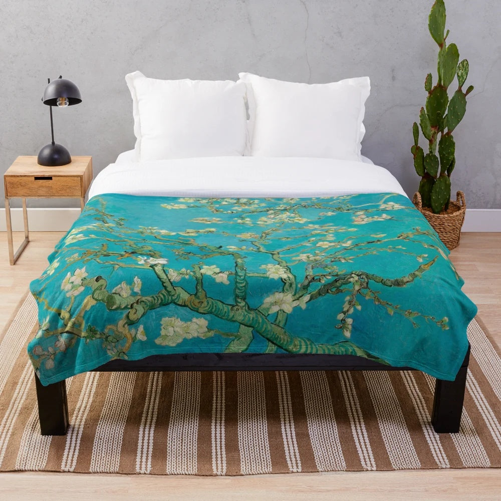 Plush blanket featuring Vincent Van Gogh's iconic "Almond Blossom" painting