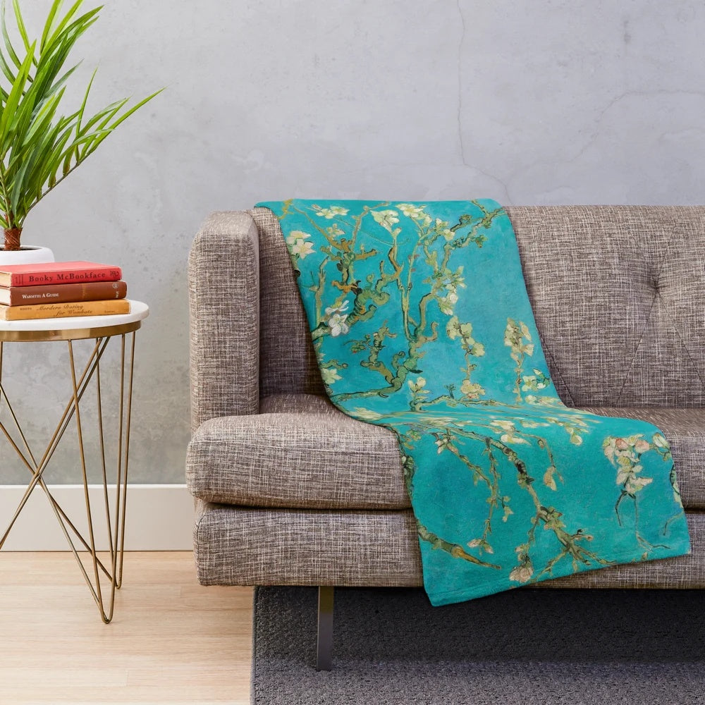 Plush blanket featuring Vincent Van Gogh's iconic "Almond Blossom" painting
