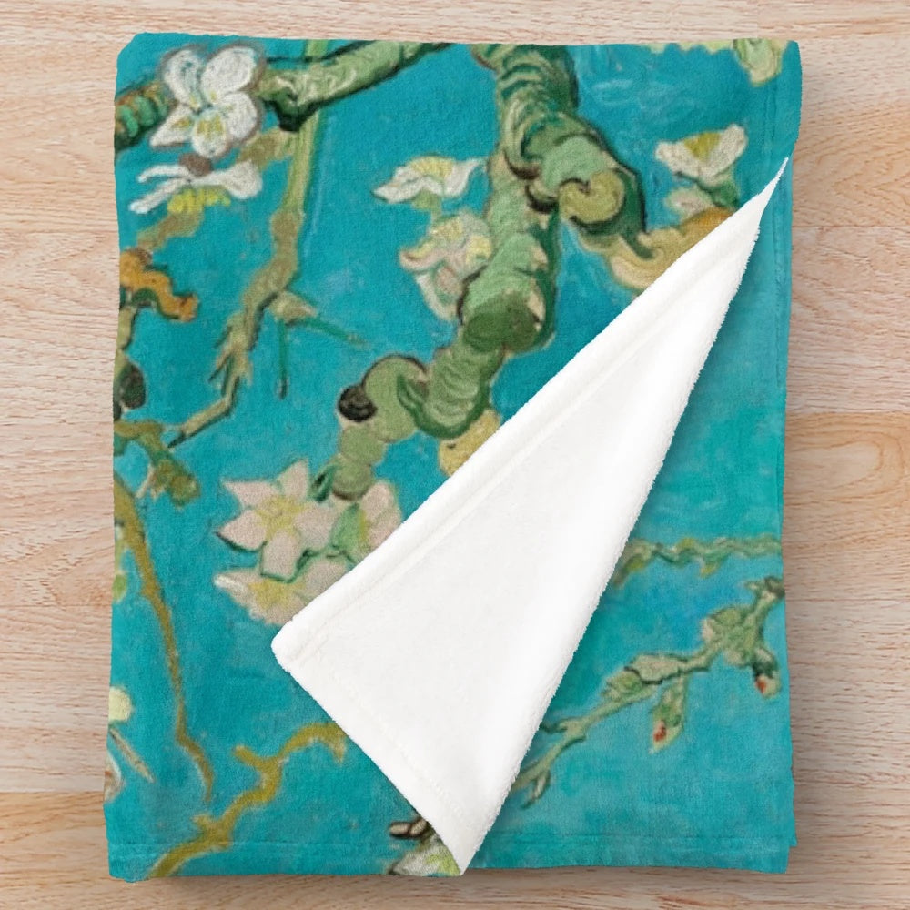 Plush blanket featuring Vincent Van Gogh's iconic "Almond Blossom" painting