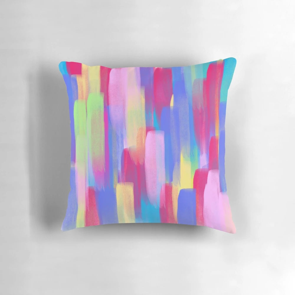 A vibrant vertical watercolor abstract accent pillow featuring bold, colorful brushstrokes