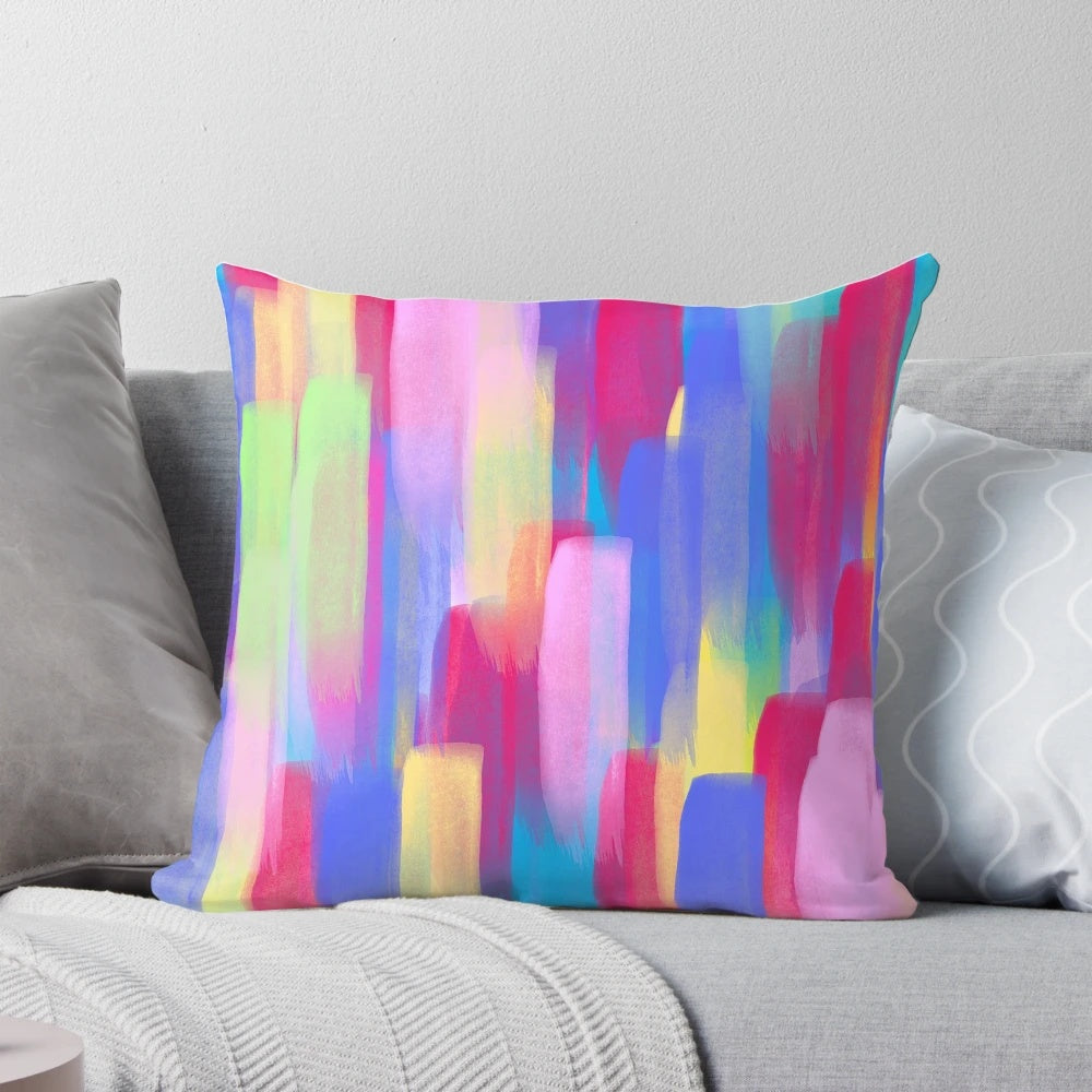 A vibrant vertical watercolor abstract accent pillow featuring bold, colorful brushstrokes