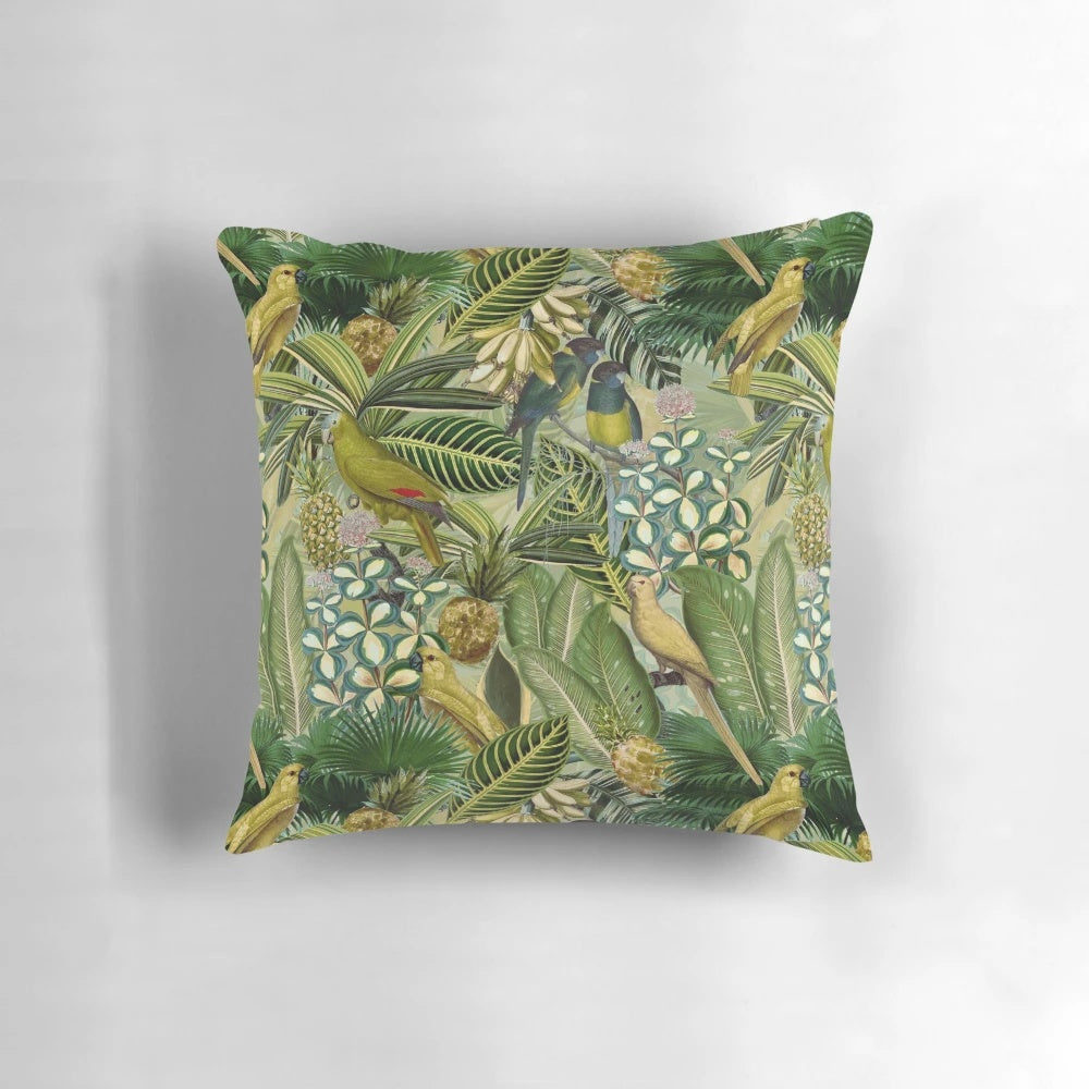 A vintage-inspired, lush green pillow featuring tropical birds and botanical designs.