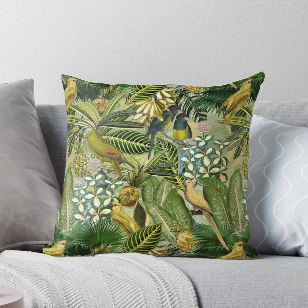A vintage-inspired, lush green pillow featuring tropical birds and botanical designs.
