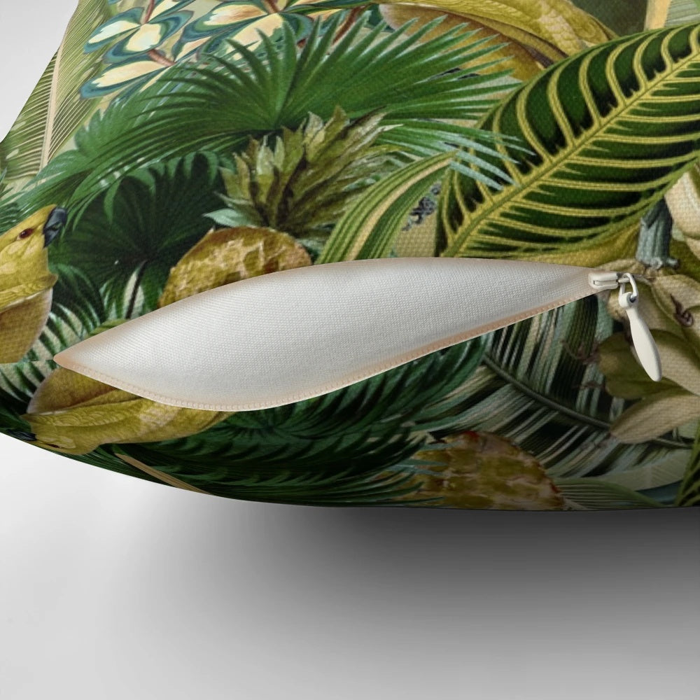 A vintage-inspired, lush green pillow featuring tropical birds and botanical designs.