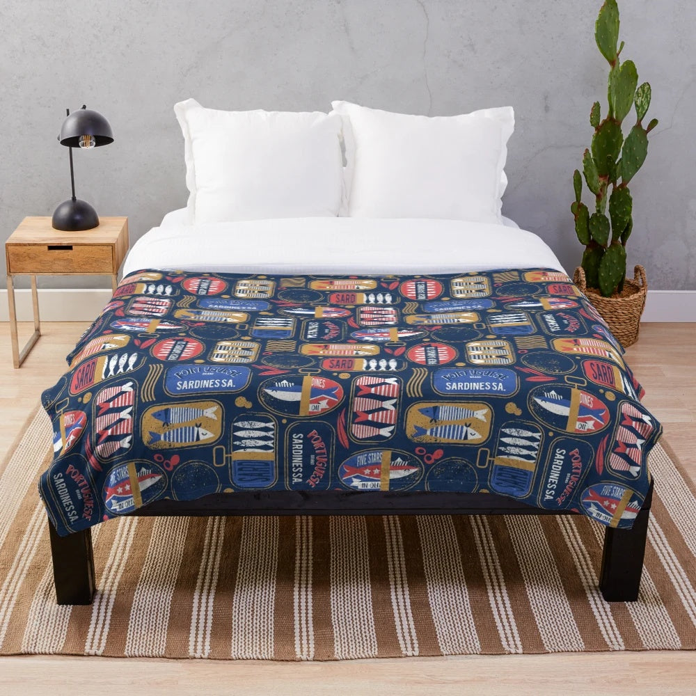 Vintage canned sardines plush blanket with navy blue, electric blue, and mandy red colors
