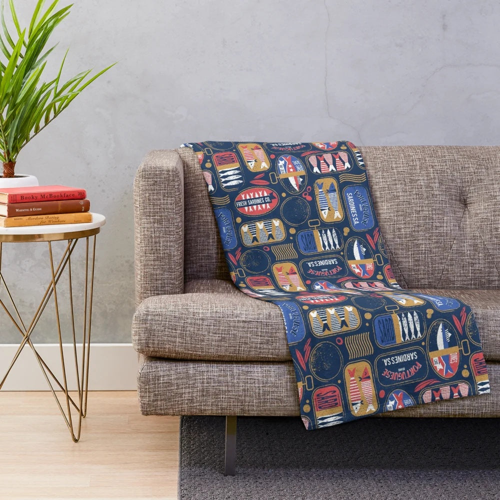 Vintage canned sardines plush blanket with navy blue, electric blue, and mandy red colors