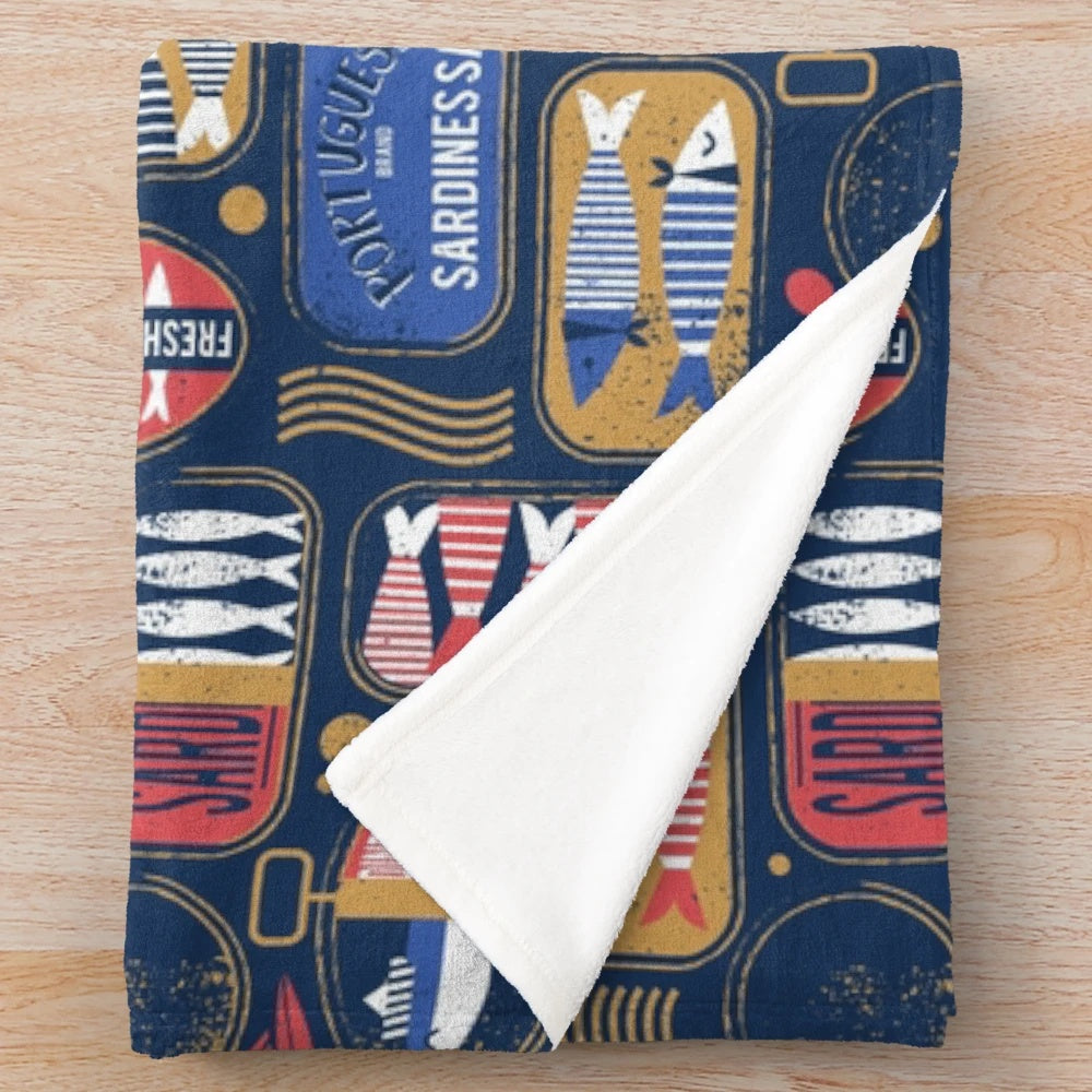 Vintage canned sardines plush blanket with navy blue, electric blue, and mandy red colors
